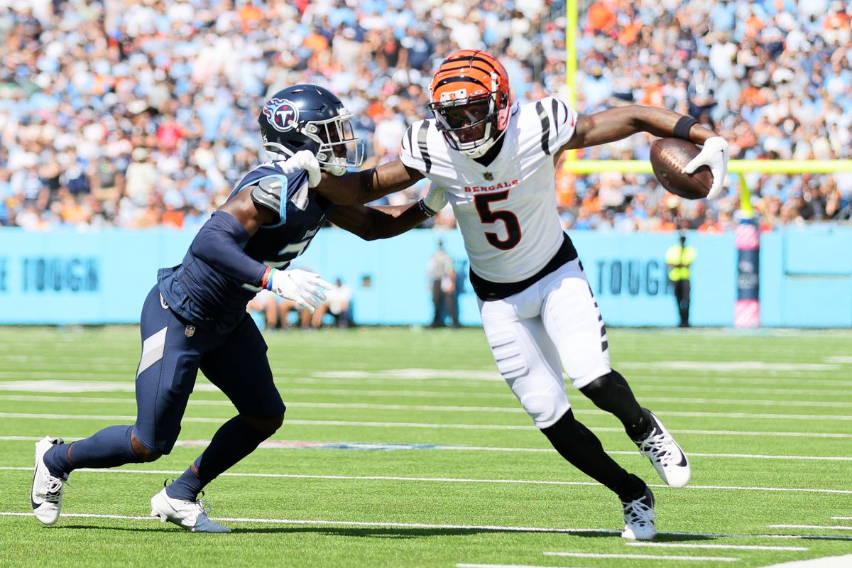 Tee Higgins #5 of the Cincinnati Bengals runs against Roger McCreary #21 of the Tennessee Titans during the first quarter at Nissan Stadium on October 01, 2023 in Nashville, Tennessee.