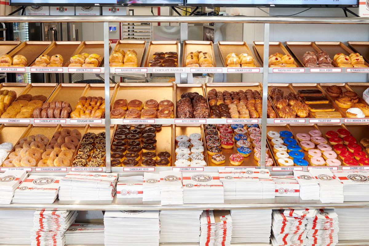 Rows and rows of doughnuts on display.
