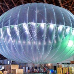 In this March 1, 2013 photo released by Google, a fully inflated test balloon sits in a hangar at Moffett Field airfield, Calif. Google is testing the balloons which sail in the stratosphere and beam the Internet to Earth. 