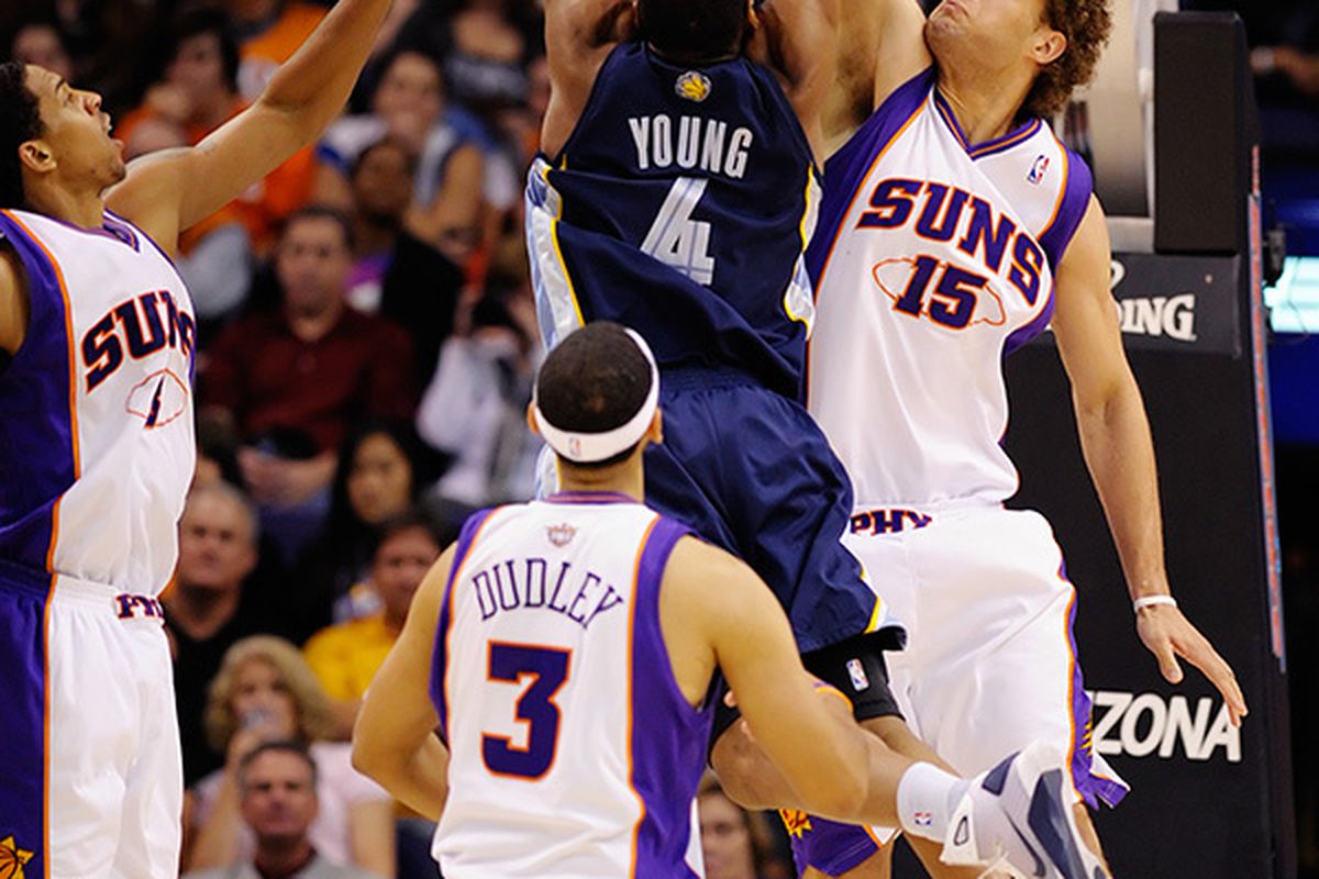 Robin Lopez (shown here blocking the Grizzlies' Sam Young) recorded 6 blocked shots in 30 minutes against the Hawks. It is time for the Suns to sacrifice some offense and give him consistent minutes at the Center position. (Photo by Max Simbron)