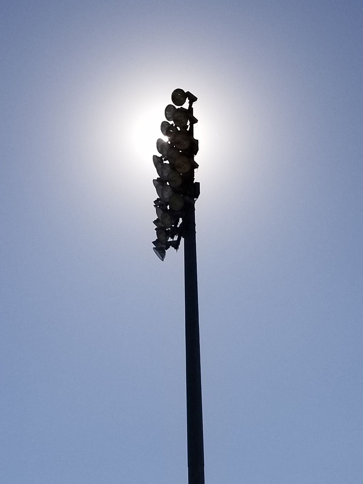 Stadium lights in the sun