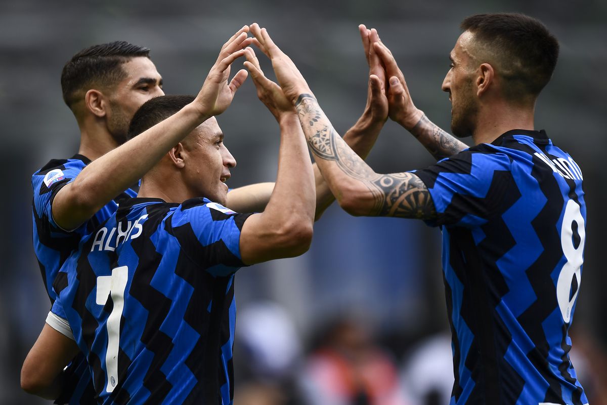 Alexis Sanchez (C) of FC Internazionale celebrates with...