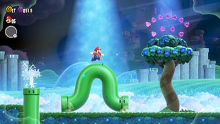 มาริโอวิ่งบนท่อโค้งในภาพหน้าจอจาก Super Mario Bros. Wonder