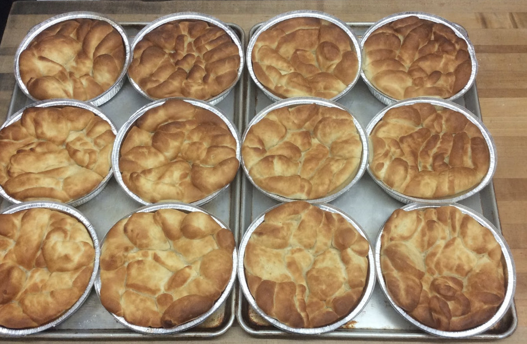 A batch of monkey bread in tin pans.