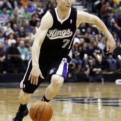 Jimmer Fredette  of Sacramento dribbles downcourt as the Sacramento Kings face the Utah Jazz in NBA basketball in Salt Lake City, Saturday, Jan. 28, 2012. Jimmer and wife Whitney recently opened up about their faith and family life to a popular LDS blog site, Normons.com.