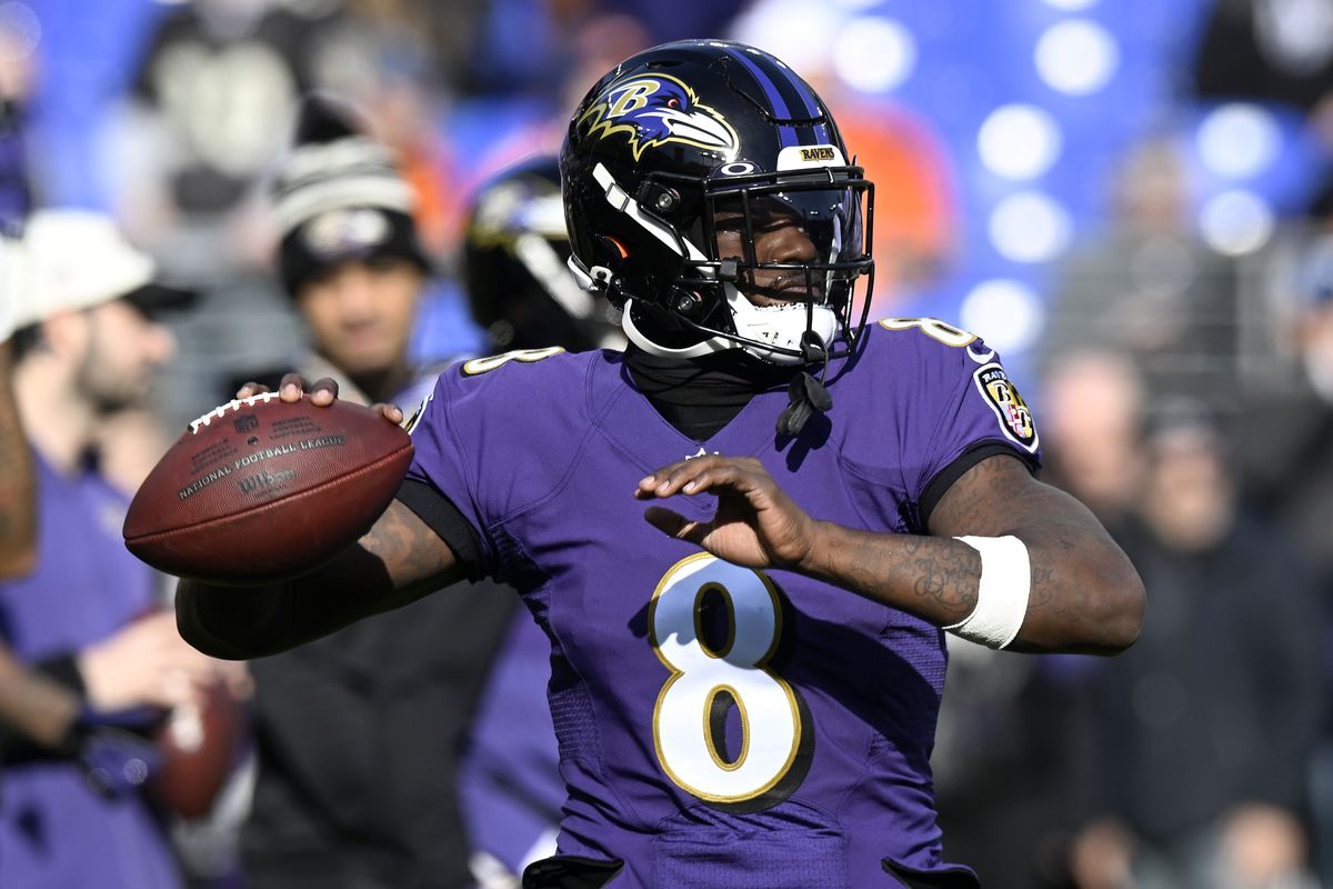 BALTIMORE, MARYLAND - DECEMBER 04: Lamar Jackson #8 of the Baltimore Ravens warms up before the game against the Denver Broncos at M&amp;T Bank Stadium on December 04, 2022 in Baltimore, Maryland.