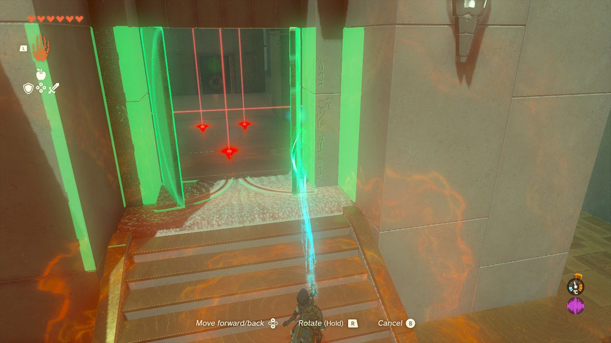 Link uses Ultrahand to open a door in the Orochium Shrine in Zelda Tears of the Kingdom.