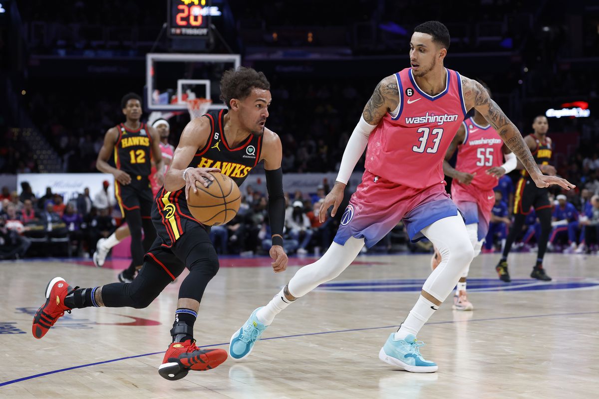 Atlanta Hawks guard Trae Young (11) drives to the basket as Washington Wizards forward Kyle Kuzma (33) defends in the first quarter at Capital One Arena.