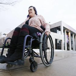 Stacy Davis-Stanford goes through campus at Westminster College where she is a student in Salt Lake City Thursday, Feb. 26, 2015. Davis-Stanford lacks health insurance and has a neurological disorder resulting from a car accident.