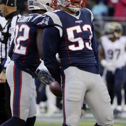 New England Patriots linebacker Kyle Van Noy (53) celebrates his interception of Los Angeles Rams quarterback Jared Goff during the second half of an NFL football game, Sunday, Dec. 4, 2016, in Foxborough, Massachusetts.