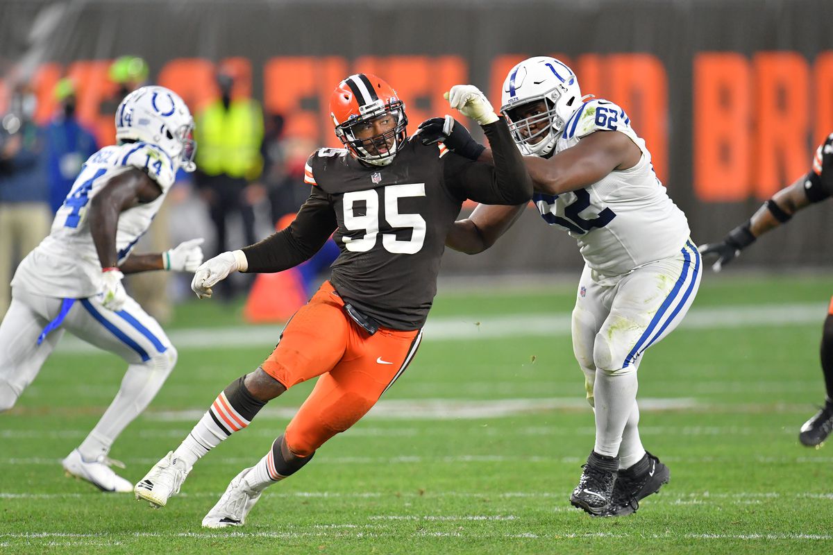 Offensive tackle Le’Raven Clark #62 of the Indianapolis Colts ties to stop defensive end Myles Garrett #95 of the Cleveland Browns during the second half at FirstEnergy Stadium on October 11, 2020 in Cleveland, Ohio.&nbsp;