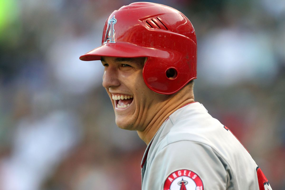 Aug 2, 2012; Arlington, TX, USA; Los Angeles Angels outfielder Mike Trout (27) laughs while on deck in the first inning against the Texas Rangers at Rangers Ballpark.  Mandatory Credit: Matthew Emmons-US PRESSWIRE