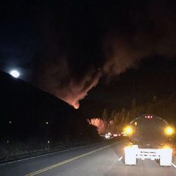 A double tanker truck loaded with crude oil rolled Friday on US-40 in Daniels Canyon, spilling its load and catching fire, according to the Utah Highway Patrol.