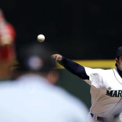 Seattle Mariners starting pitcher Hisashi Iwakuma throws against the Los Angeles Angels in the third inning of a baseball game on Sunday, April 28, 2013, in Seattle, Wash. 