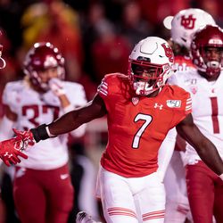Utah Utes running back Devonta’e Henry-Cole (7) celebrates after scoring a touchdown on a pass from quarterback Tyler Huntley (1), putting the Utes up 7-0 over the Washington State Cougars after the PAT, at Rice-Eccles Stadium in Salt Lake City on Saturday, Sept. 28, 2019.