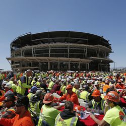 FILE - In this April 7, 2015, file photo, construction workers eat lunch by an MGM arena being built behind the New York-New York casino-hotel in Las Vegas. A person with direct knowledge of the NHL's decision says the league has settled on Las Vegas as its choice for expansion, provided organizers can come up with a $500 million fee. The person spoke Tuesday, June 14, 2016,  on condition of anonymity because details have not been released by the league ahead of its Board of Governors meeting on June 22. 