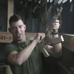 In this 2008 photo provided by Corey Smalley, Eddie Ray Routh poses with an AK-47 at Camp Fallujah in Iraq. For the Marines who served with him in the Iraqi desert, the man on trial for gunning down "American Sniper" Chris Kyle and a friend is not the Eddie Ray Routh they knew. The 27-year-old veteran stands charged with capital murder in the Feb. 2, 2013, slayings of the former Navy SEAL and his friend, Chad Littlefield. The two men had taken Routh to a shooting range after Routh's mother asked Kyle to help her son cope with debilitating post-traumatic stress disorder and other personal demons. 