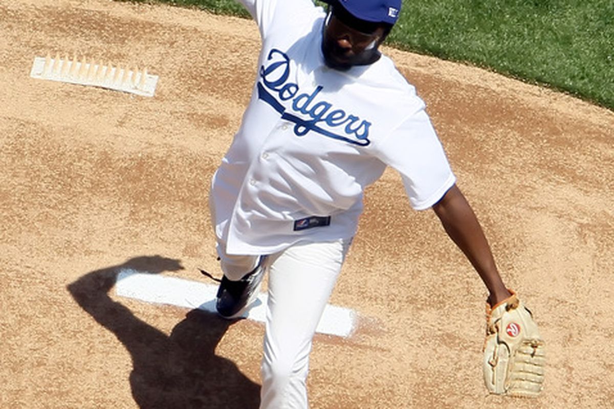 This is WILL.I.AM in a Dodgers uniform. Scientists are still working to discover why the universe didn't collapse upon itself in a black hole of suck and evil as soon as he put the hat on.