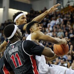 Julion Pearre (5) of Utah State goes up for a shot against Goodluck Okonoboh (11) of UNLV during NCAA basketball in Logan Tuesday, Feb. 24, 2015.


