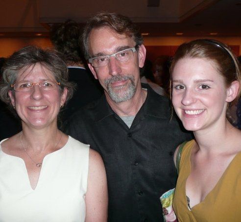Jeanne Marie Uzdawinis (left) with husband John Boesche and daughter Madeleine. | Facebook photo
