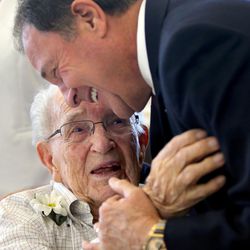 Milton Anderson, 101, hugs Gov. Gary Herbert at the 31st Centenarian Celebration at the Viridian Event Center in West Jordan on Thursday, Aug. 17, 2017.