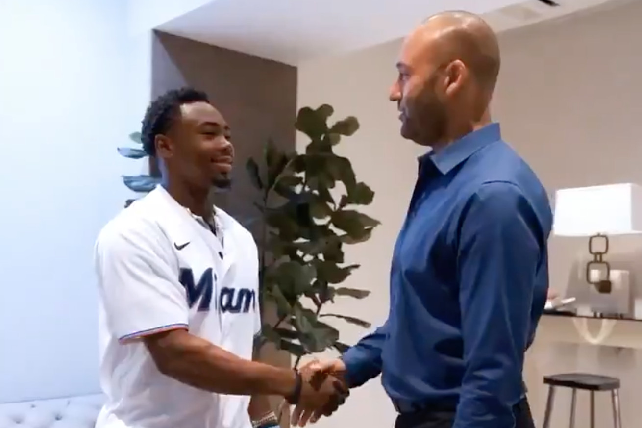 Marlins draft pick Kahlil Watson shakes hands with CEO Derek Jeter