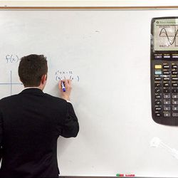 Kent Williams from Bountiful High does a calculus problem during the Sterling Scholar preliminary judging at Northridge High School in Layton on Wednesday.