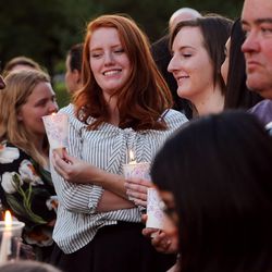 Kwaku El, Becca Wood and Claire Forste talk as they attend a solidarity vigil to stand against white supremacy and racism hosted by BYU college Republican and Democrat clubs in Provo on Sunday, Aug. 20, 2017.