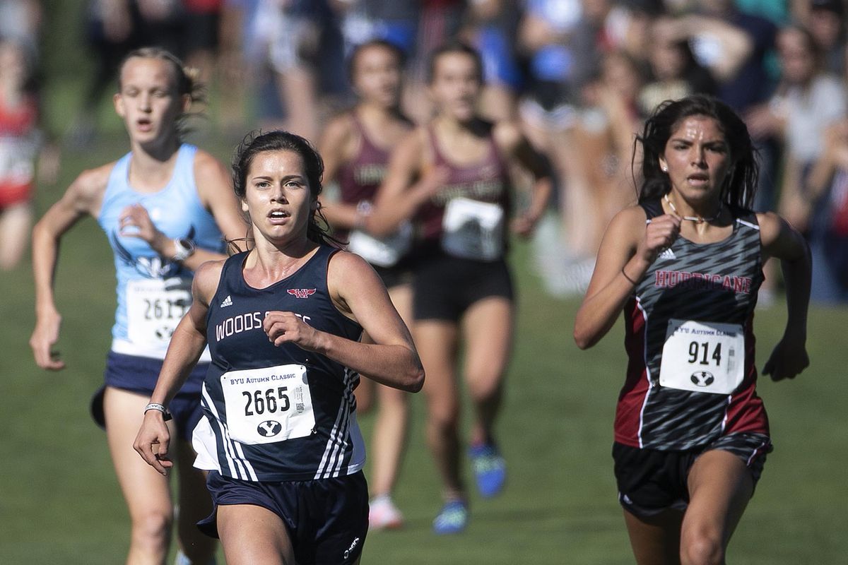 Woods Cross High School’s Carlee Hansen leads the pack to win the girls varsity 5K during the BYU Autumn Classic Cross Country Invitational at the East Bay Golf Course Saturday, Sept. 14, 2019 in Provo. Westlake High’s Emma Heslop took second with Hurricane High’s Caila Odekirk taking third.