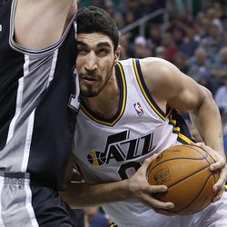 Utah Jazz's center Enes Kanter (0) pushes on Spurs' Aron Baynes as the Utah Jazz and the San Antonio Spurs play Saturday, Dec. 14, 2013 at EnergySolutions Arena in Salt Lake City. The Spurs won 100-84.