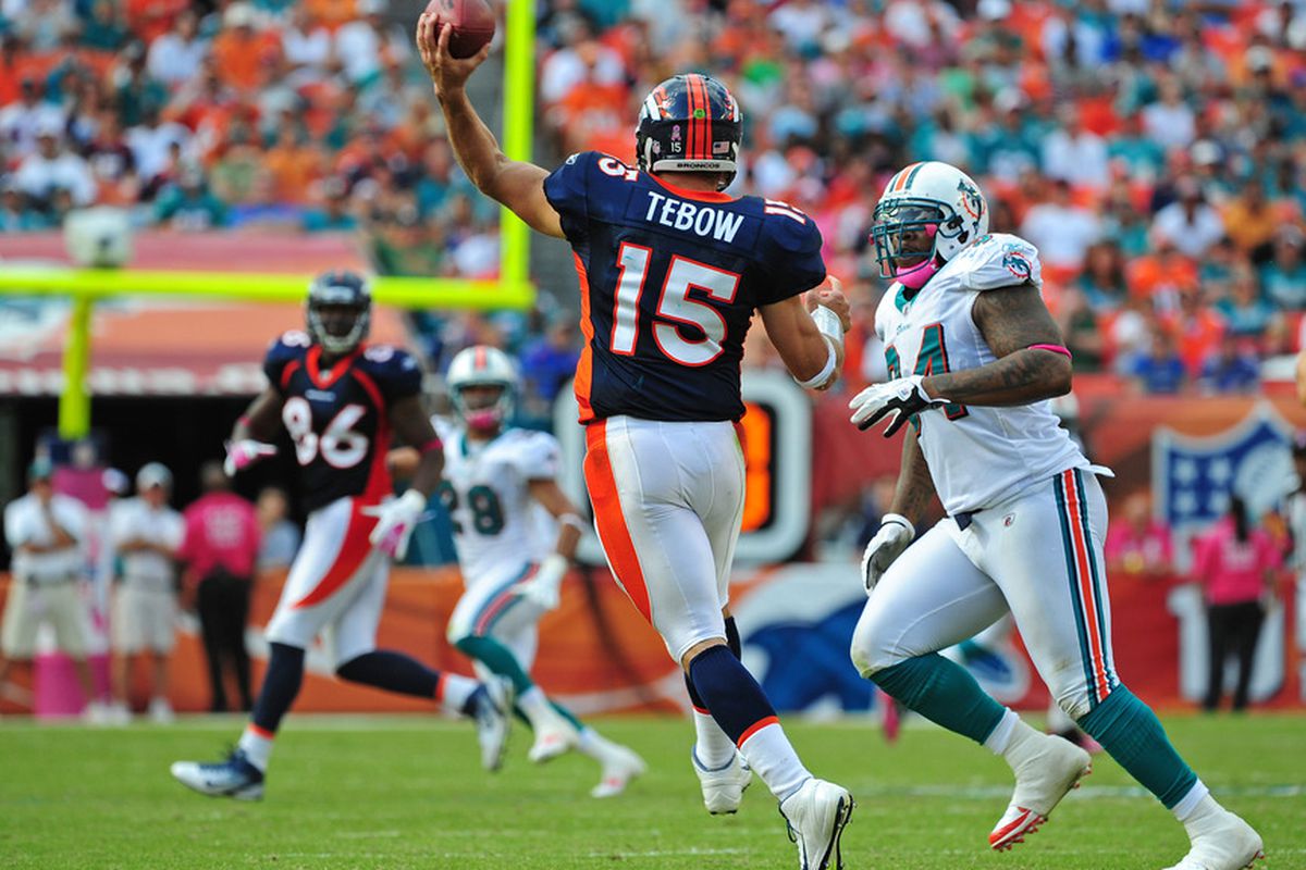 MIAMI GARDENS, FL - OCTOBER 23: Tim Tebow #15 of the Denver Broncos passes against the Miami Dolphins at Sun Life Stadium on October 23, 2011 in Miami Gardens, Florida. (Photo by Scott Cunningham/Getty Images)