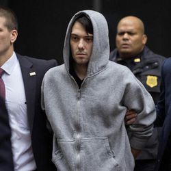 FILE; Martin Shkreli, the former hedge fund manager under fire for buying a pharmaceutical company and ratcheting up the price of a life-saving drug, is escorted by law enforcement agents in New York Thursday, Dec. 17, 2015, after being taken into custody following a securities probe. 