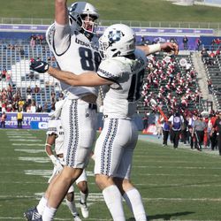 Utah State tight end Carson Terrell (88) celebrates a touchdown with wide receiver Brandon Bowling (16) in the second half while playing against San Diego State during an NCAA college football game for the Mountain West Conference Championship, Saturday, Dec. 4, 2021, in Carson, Calif. 