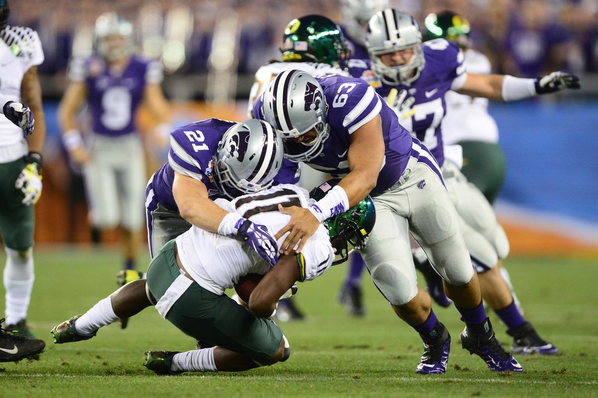 Last year, Marcus Heit (63) finally got to play in a bowl game. It looks like he even got in on some tackling.