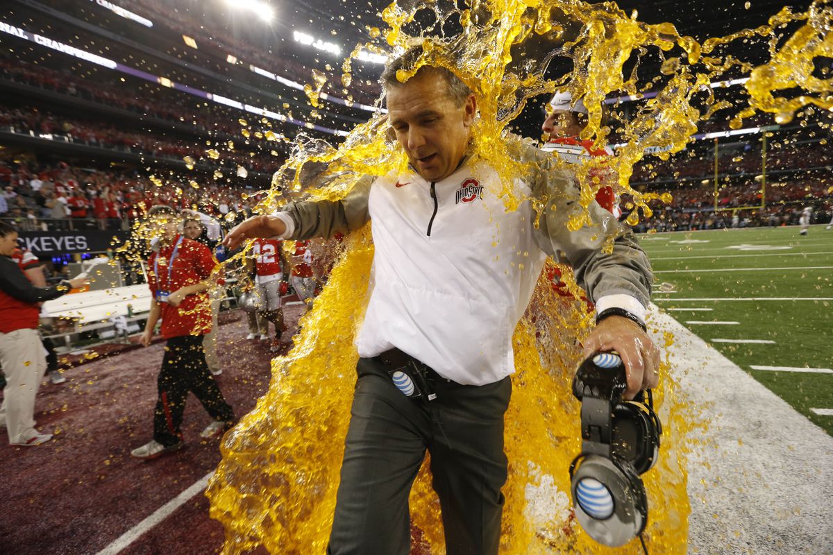 Ohio State head coach Urban Meyer is doused with Gatorade after his Buckeyes won the first-ever College Football playoff Monday over Oregon.