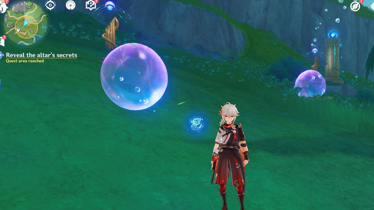 A character stands near two floating bubbles in a field in Genshin Impact.