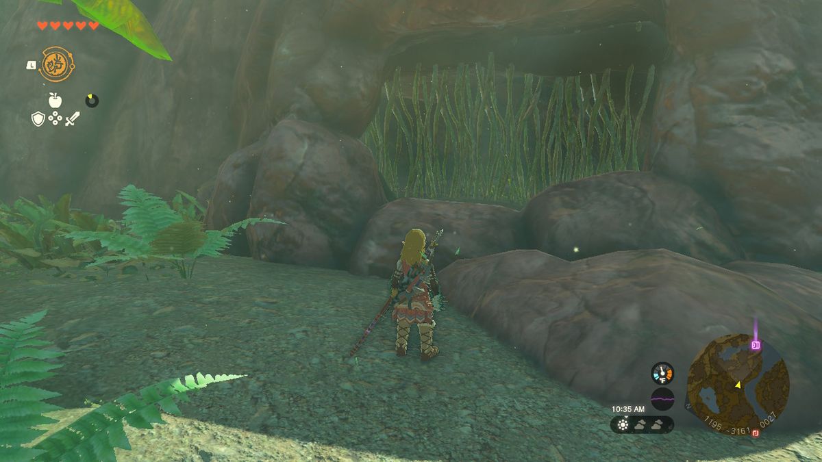 Link looks at an entrance to the cave containing the Rubber Armor head piece in Zelda Tears of the Kingdom.