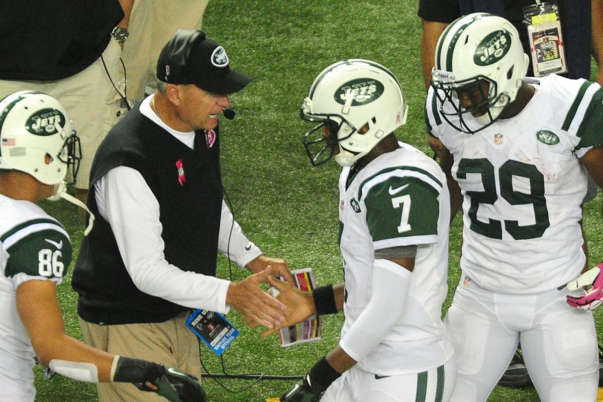 Rex Ryan discreetly thanks Geno Smith (#7) for keeping him gainfully employed another week. 