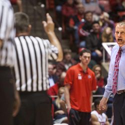 Utah Head Coach Larry Krystkowiak disagrees with officials during a pause in the action as Utah and USC play Saturday, Jan. 12, 2013 in the Hunstman Center. Utah lost 59-76.