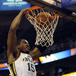 Utah Jazz power forward Derrick Favors (15) gets the dunk during a game at EnergySolutions Arena on Monday, December 2, 2013.