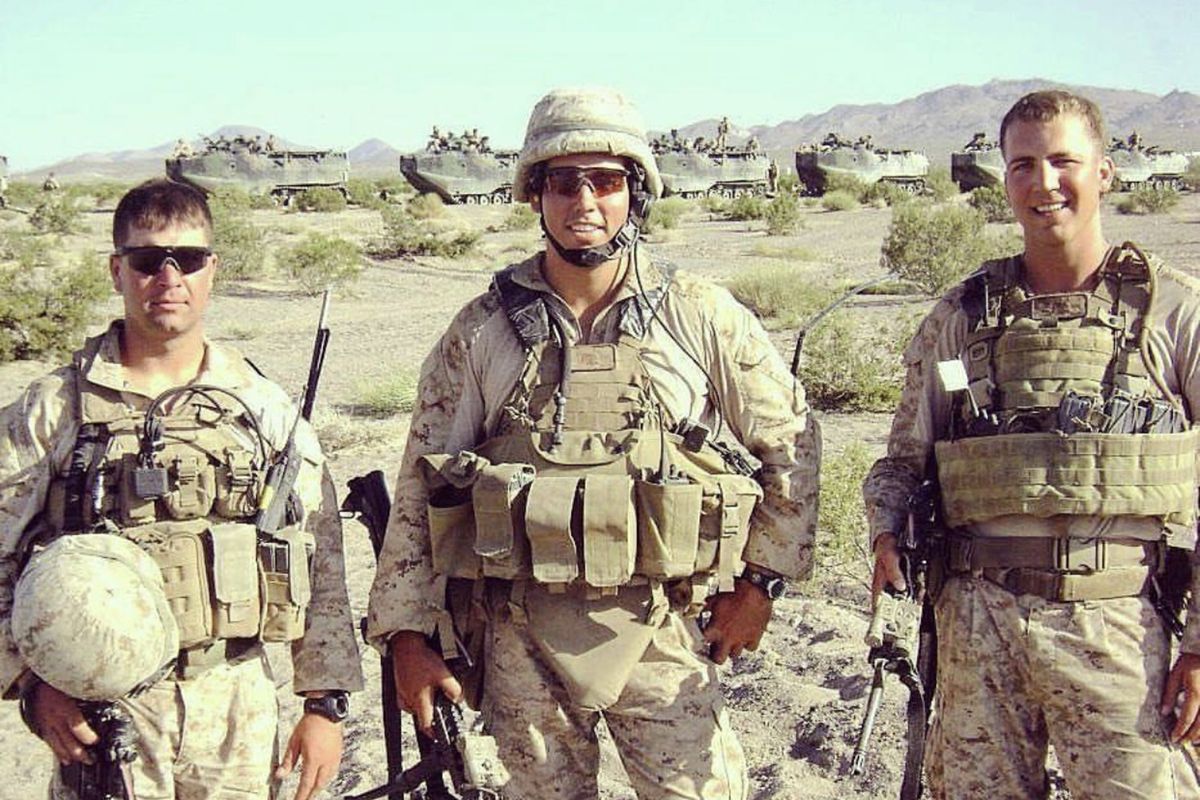 Marine Maj. Thomas Schueman (right), a Chicago native, in Afghanistan. At left is Lt. William Donnelly, a friend of Schueman who was killed in action. Center is First Lt. Cameron West.