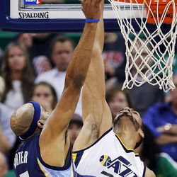 Utah Jazz center Rudy Gobert (27) blocks a shot by Memphis Grizzlies guard Vince Carter (15) during NBA basketball in Salt Lake City on Monday, Nov. 14, 2016.