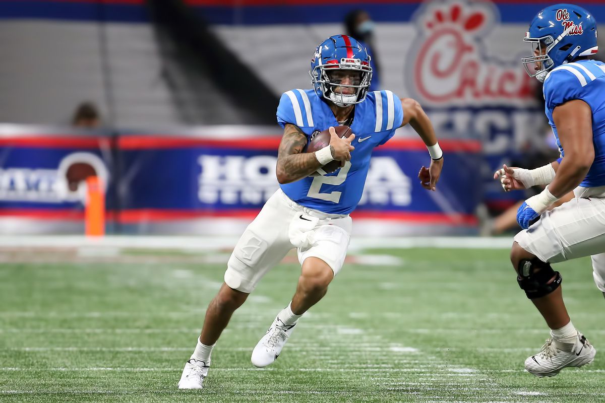 Mississippi Rebels quarterback Matt Corral carries the ball during the Chick-fil-A Kickoff Game between the Louisville Cardinals and the Ole Miss Rebels on September 6, 2021 at Mercedes Benz Stadium in Atlanta, Georgia.