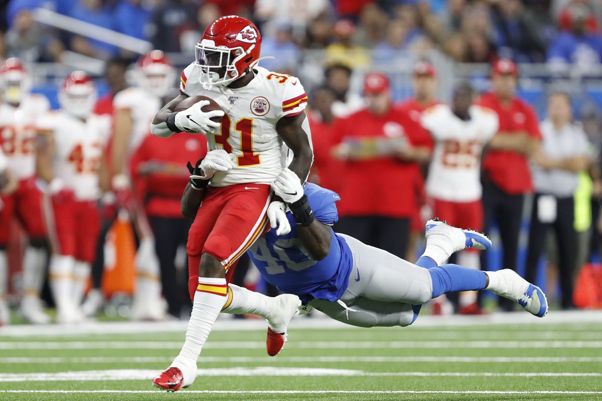 Kansas City Chiefs running back Darrel Williams carries the ball as Detroit Lions middle linebacker Jarrad Davis defends during the second quarter at Ford Field.