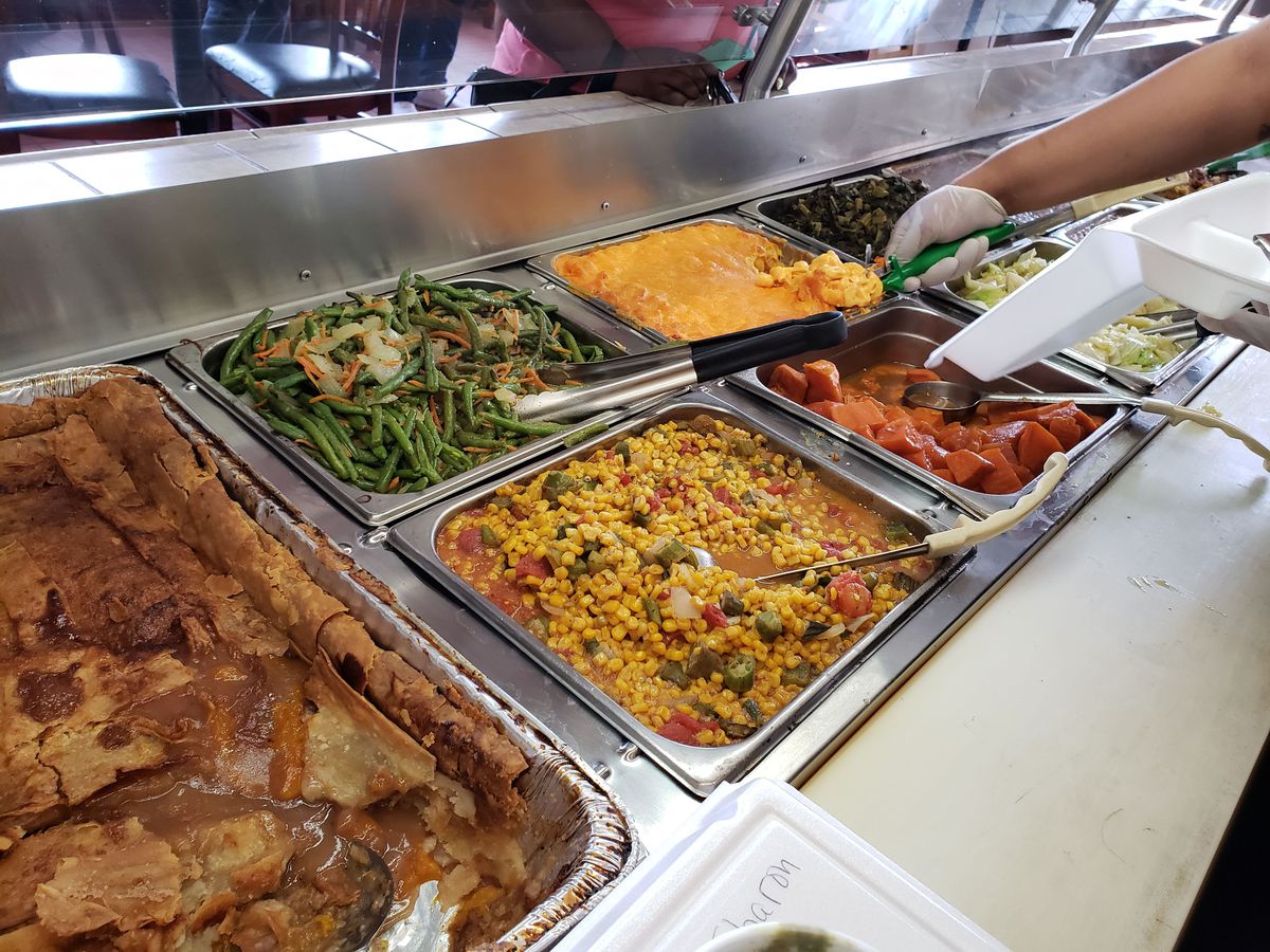 Various hot dishes from Dulan’s On Crenshaw Soul Food Restaurant