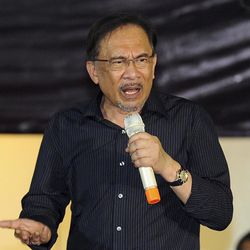 In this Oct. 27, 2014 photo, Malaysian opposition leader Anwar Ibrahim gestures while speaking during a solidarity gathering ahead of his final hearing of his sodomy conviction in Subang Jaya outside Kuala Lumpur, Malaysia. Anwar said he hopes for a just decision when Malaysia's top court rules on his final appeal against a sodomy conviction, but that he's ready to be jailed for the second time in just over a decade. The Federal Court will announce Tuesday, Feb. 10, 2014 whether it will uphold Anwar's five-year sentence for sodomizing a male aide. 