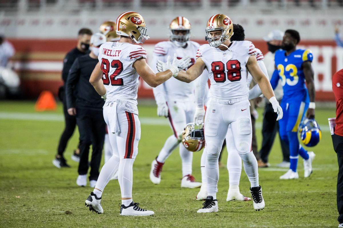 San Francisco 49ers Tight End Ross Dwelley (82) and San Francisco 49ers Tight End Daniel Helm (88) celebrate their victory after the NFL football game between the Los Angeles Rams and San Francisco 49ers on October 18, 2020 in Santa Clara, CA.