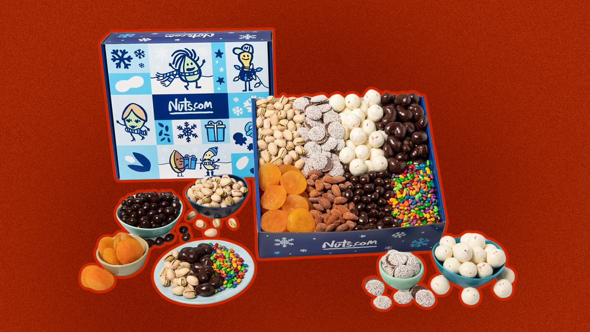 A gift box of snacks including nuts and chocolate and apricots