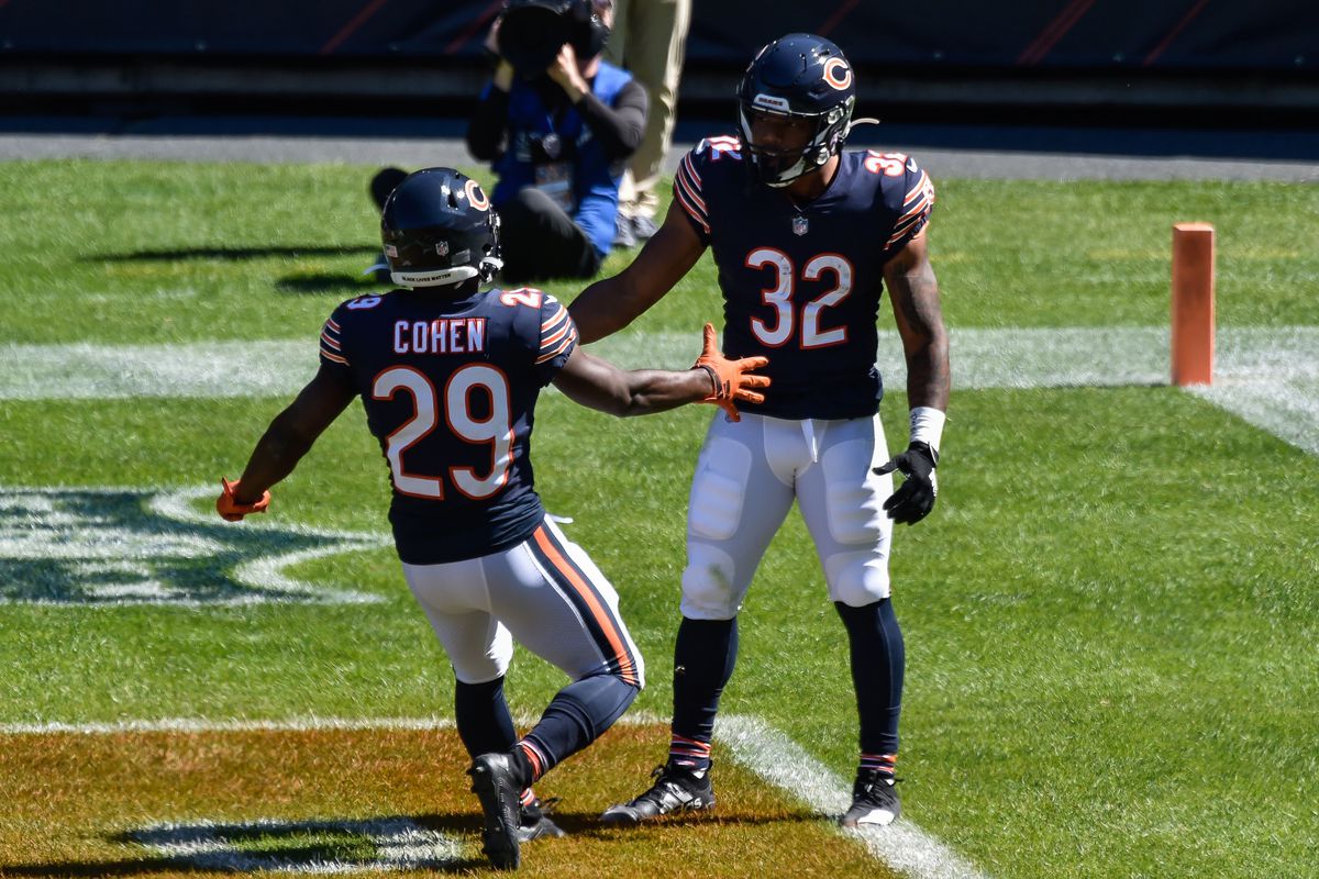 Chicago Bears running back Tarik Cohen and running back David Montgomery celebrate a touchdown reception by Montgomery from quarterback Mitchell Trubisky (not pictured) during the first quarter against the New York Giants at Soldier Field