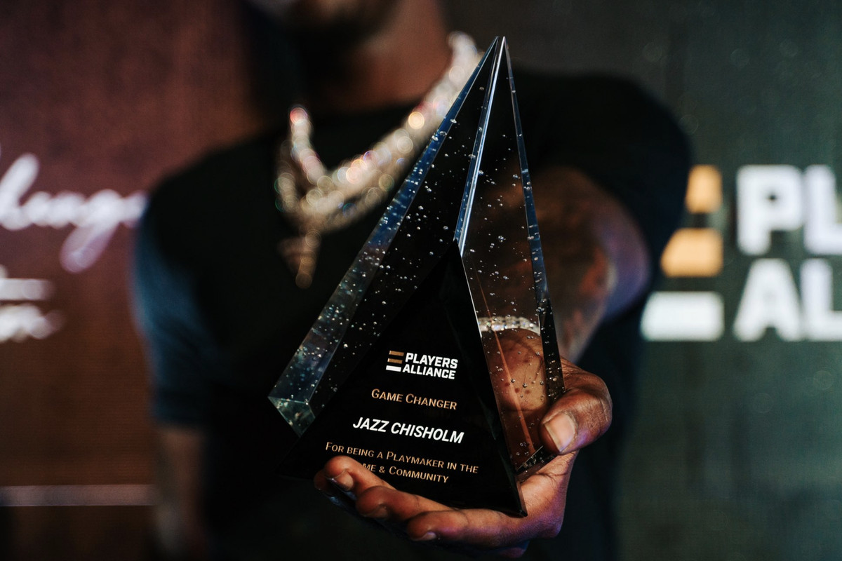 Jazz Chisholm Jr. holds his Game Changer Award, presented to him on December 16, 2022 by the Players Alliance